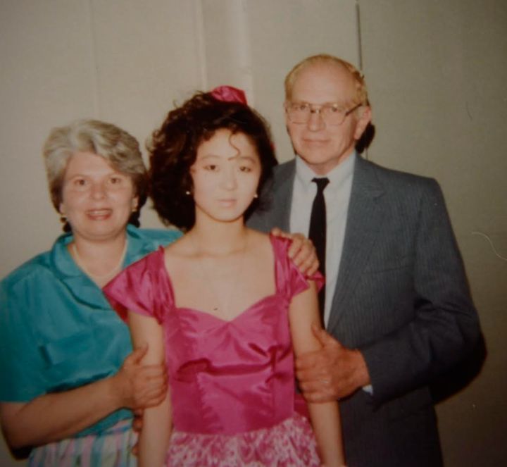 The author with her parents at her eighth grade graduation.