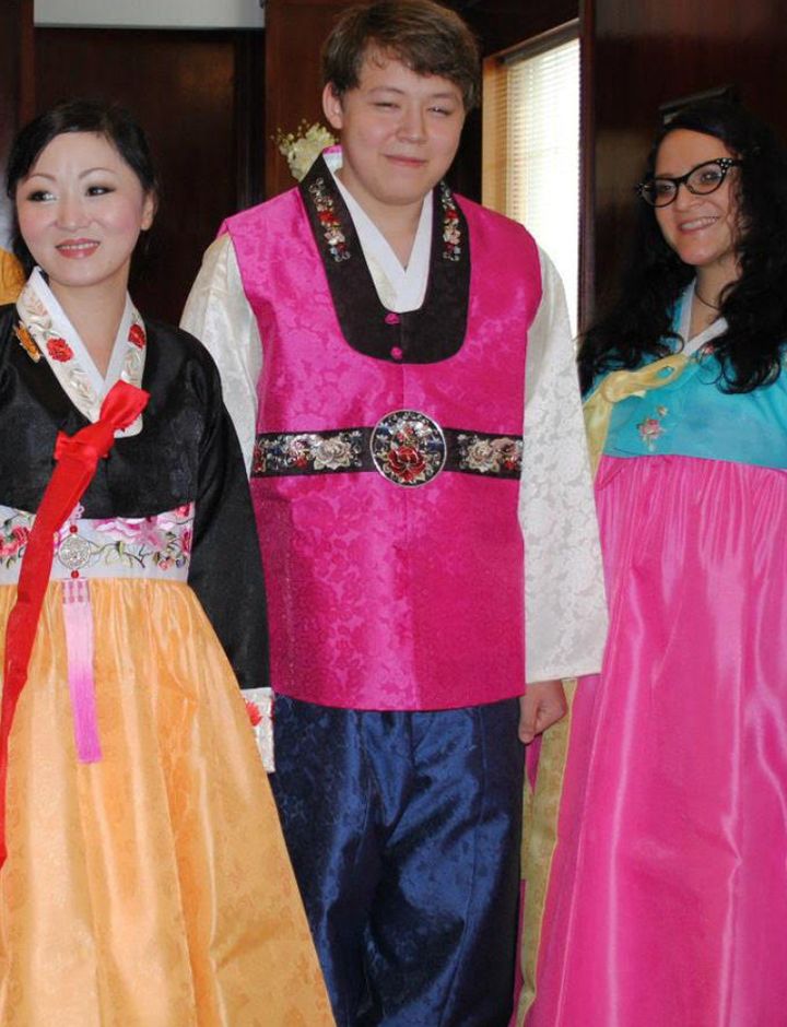 The author (left) with her son and her best friend Jackie at the reunion with her mom and twin sister in 2011. "My Korean family brought along hanboks for all of us," she writes.