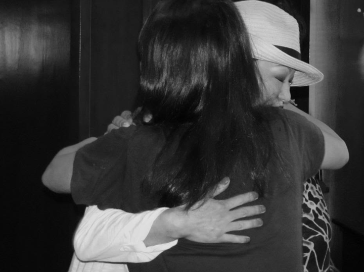 The author hugging her twin sister for the first time.