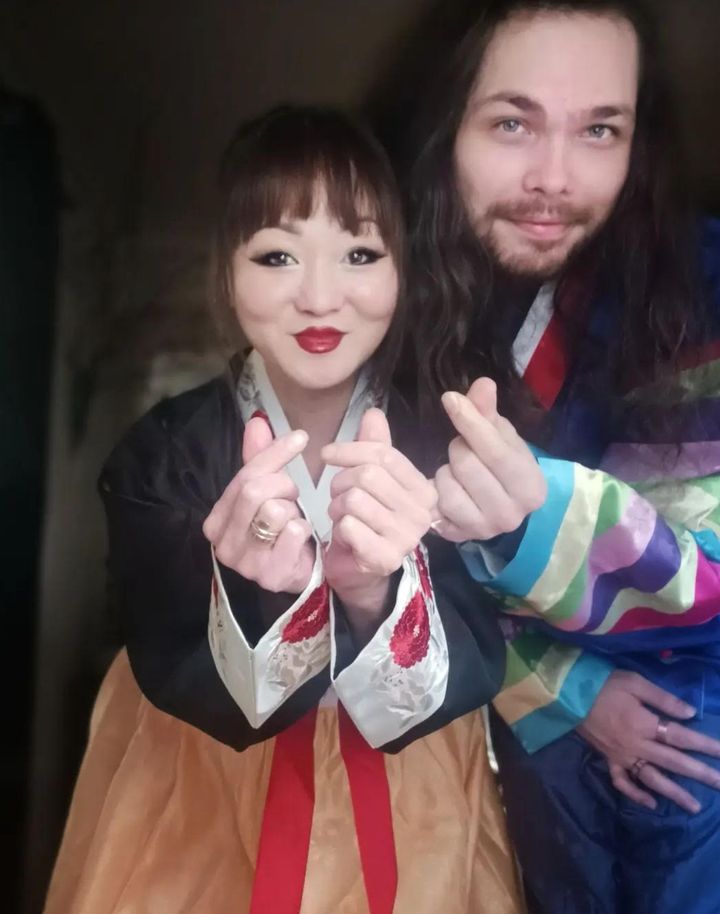 The author and her husband dressed in their hanboks on their one-year wedding anniversary.