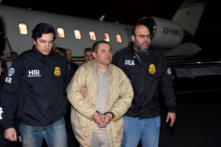 Joaquin "El Chapo" Guzman, being escorted, from a plane to a waiting caravan of SUVs at Long Island MacArthur Airport.