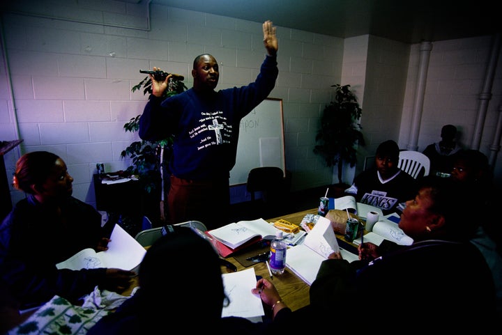 Tenants wishing to become security guards at the Cabrini-Green housing project undergo handgun training.