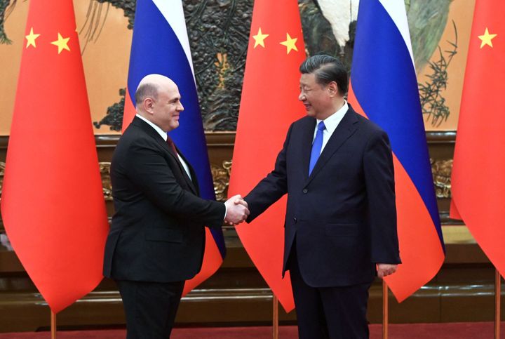 Russian Prime Minister Mikhail Mishustin meets with China's President Xi Jinping in Beijing on May 24, 2023.