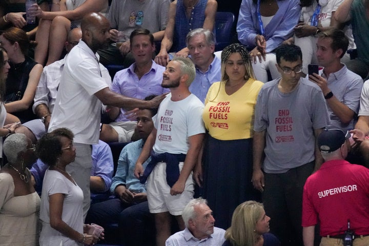 Protesters in the stands at Arthur Ashe Stadium interrupted the U.S. Open semifinal match between Gauff and Muchová.