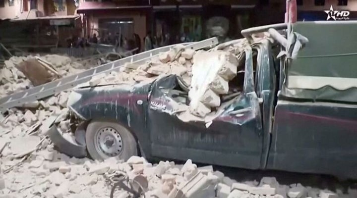 View of a damaged car and debris from the earthquake in Marrakech, Morocco September 9, 2023 in this screen grab taken from a video. Al Oula TV/Handout via REUTERS