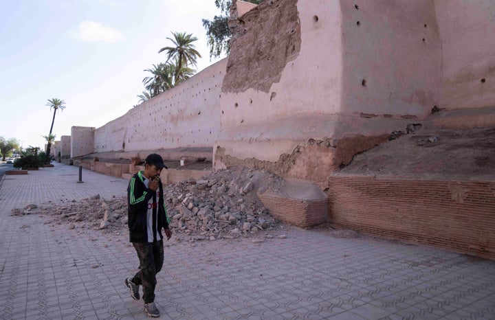 A man walks past a damaged wall of the historic Medina of Marrakech after an earthquake in Morocco, Saturday, Sept. 9, 2023. (AP Photo/Mosa'ab Elshamy)