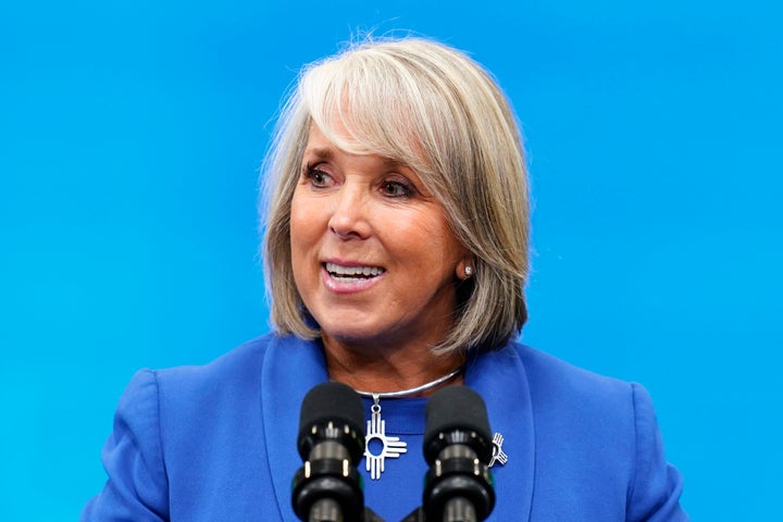 Democratic New Mexico Gov. Michelle Lujan Grisham talks prior to President Joe Biden speaking about the economy at Arcosa Wind Towers factory Wednesday, Aug. 9, 2023, in Belen, N.M. (AP Photo/Ross D. Franklin)