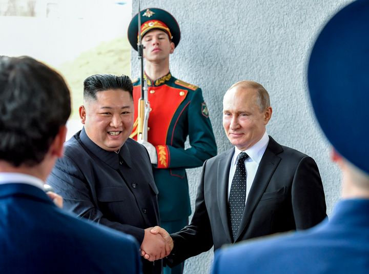 FILE - Russian President Vladimir Putin, center right, and North Korea's leader Kim Jong Un shake hands during their meeting in Vladivostok, Russia, Thursday, April 25, 2019. U.S. officials expect Kim to visit Russia in the coming days to seal a possible deal on munitions as Moscow seeks to replenish its military machine by tapping Pyongyang's huge arsenal. (Yuri Kadobnov/Pool Photo via AP, File)