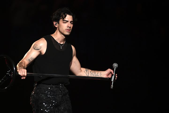Joe Jonas of the Jonas Brothers performs in support of their "Five Albums. One Night." tour at MGM Grand Garden Arena on Friday in Las Vegas.