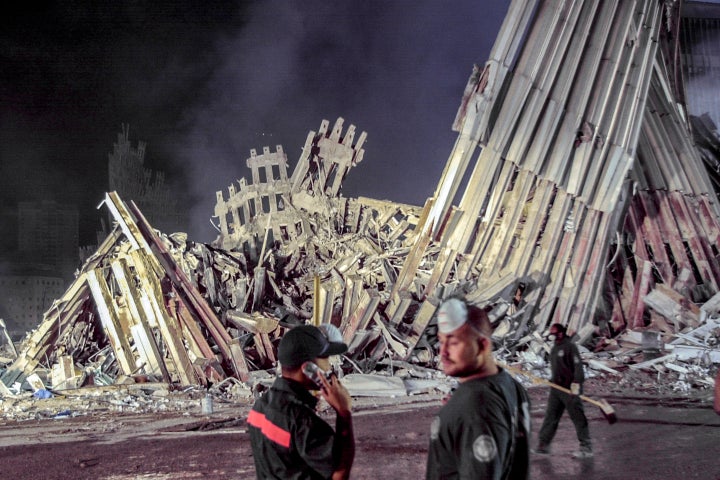 First responders work at ground zero after the Sept.11 attacks, Sept. 12, 2001, in New York. 