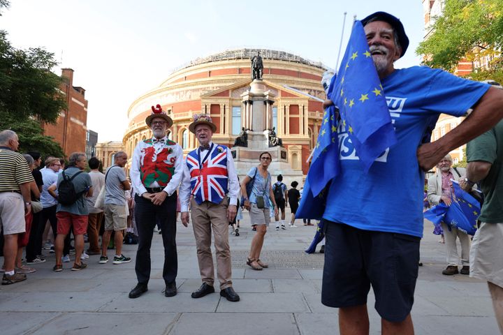 Pro-EU activists hand out EU flags as concert-goers arrive at the Royal Albert Hall in London on September 9, 2023.