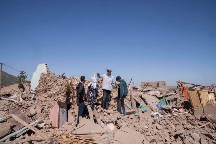 People inspect the damage caused by the earthquake in the village of Tafeghaghte, near Marrakech, Morocco, on Sept. 11, 2023.