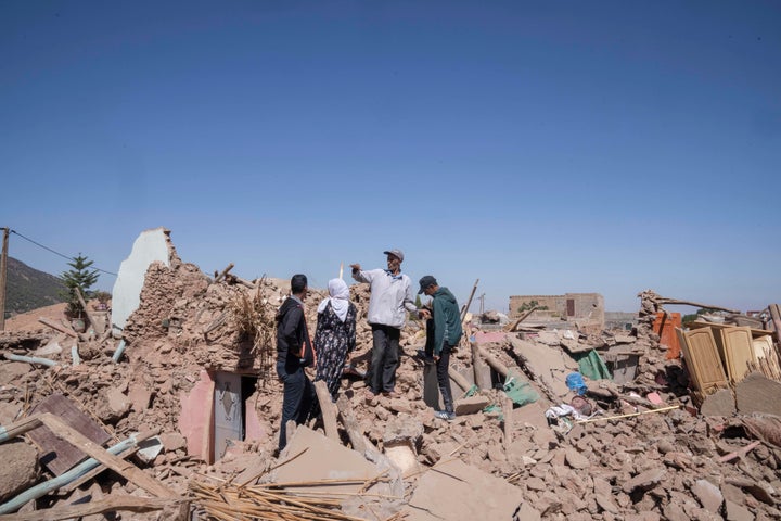 Individuals check the damage brought on by the earthquake in the town of Tafeghaghte, near Marrakech, Morocco, on Sept. 11, 2023. 