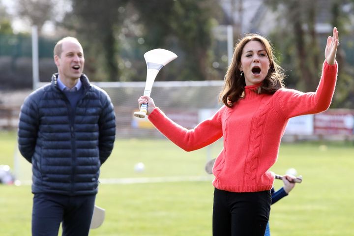 Prince William reacts as the then-Duchess of Cambridge attempts to play hurling at a club in Galway, Ireland, on March 5, 2020.