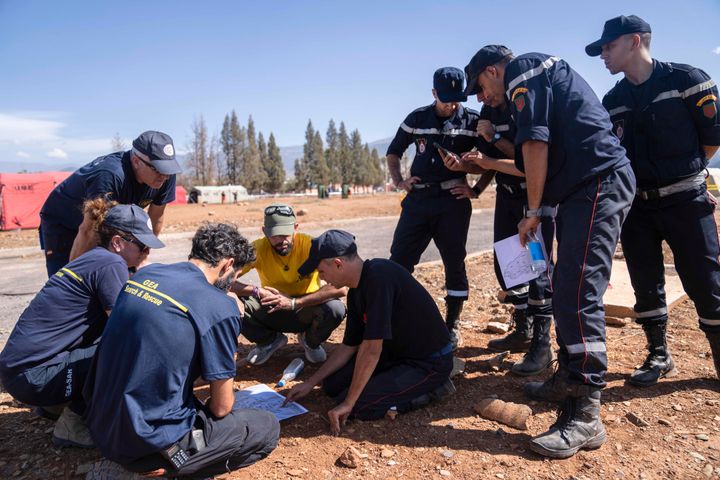 Moroccan and Spanish emergency units discuss plans at a military camp in the town of Amizmiz, near Marrakech, Morocco, on Sept. 11, 2023.