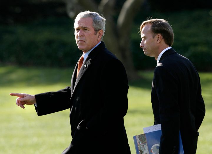 Former President George W. Bush walks with Mark Dybul, then the U.S. Global AIDS Coordinator at the State Department, at the White House in 2007.