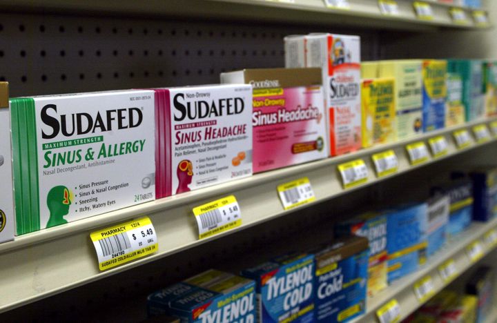 Sudafed and other common nasal decongestants containing pseudoephedrine are on display behind the counter at an Oklahoma pharmacy.