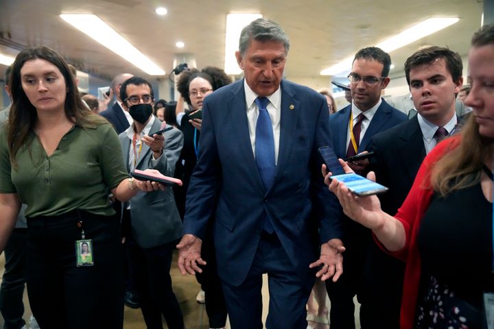 Sen. Joe Manchin (D-W.Va.) talks with reporters at the U.S. Capitol Wednesday. Manchin sided with Republicans in the Senate against extending a bigger child tax credit in pandemic-era aid bills.