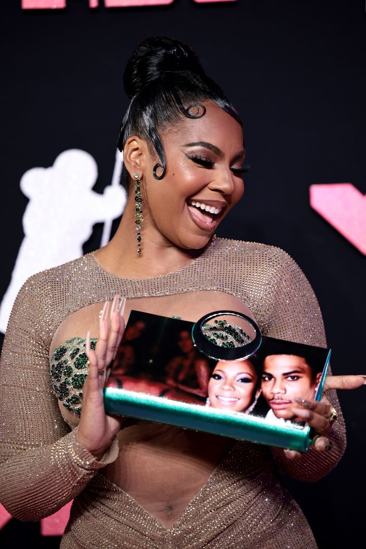 Ashanti carried a handbag with her and boyfriend Nelly's face on it at the 2023 MTV Video Music Awards on Tuesday.