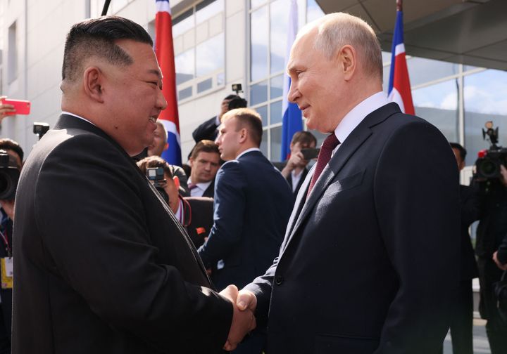 Russia's President Vladimir Putin (R) shakes hands with North Korea's leader Kim Jong Un (L) during their meeting at the Vostochny Cosmodrome in Amur region on September 13, 2023.