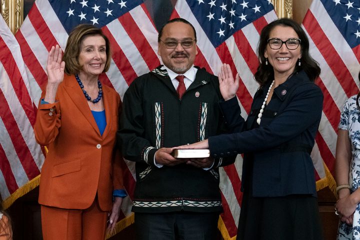 Speaker of the House Nancy Pelosi of California administers the oath of office to Rep. Mary Peltola (D-Alaska), accompanied by her husband, Eugene “Buzzy” Peltola Jr., in September 2022.