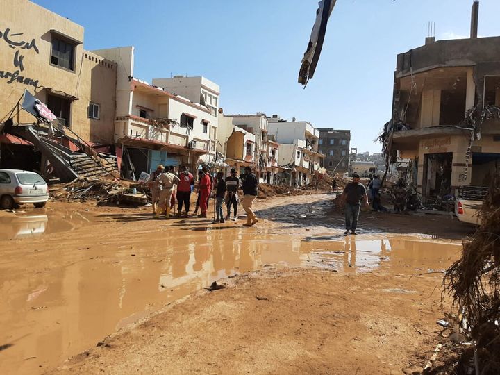 Members of the Libyan Red Crescent in Ajdabiya work in an area affected by floods.