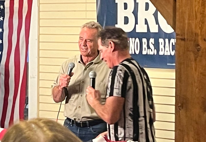 Democratic presidential candidate Robert F. Kennedy Jr. appears at former Republican Sen. Scott Brown's "No BS" barbecue campaign gathering in New Hampshire on Wednesday night.