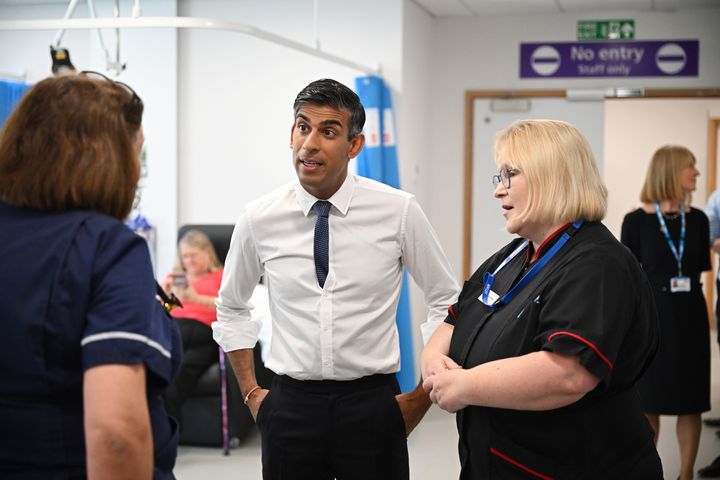 MILTON KEYNES, ENGLAND - AUGUST 15: Prime Minister Rishi Sunak speaks to staff and patients in the SDEC, same day emergency care unit, during a visit to Milton Keynes University Hospital on August 15, 2023 in Milton Keynes, England. (Photo by Leon Neal - WPA Pool/Getty Images)