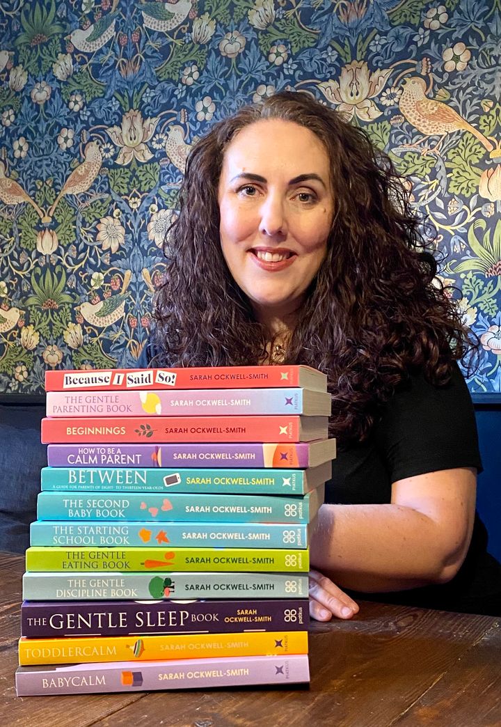 The author pictured with a vast range of her parenting books. 