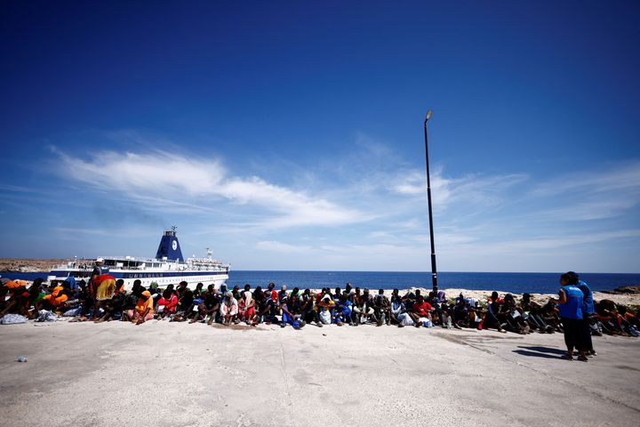 Migrants wait near the port to be transferred to the mainland, on the Sicilian island of Lampedusa, Italy, September 14, 2023. REUTERS/Yara Nardi