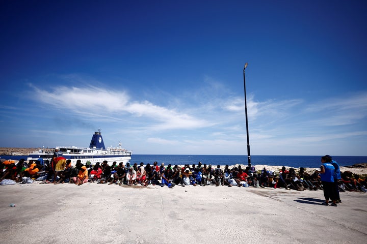 Migrants wait near the port to be transferred to the mainland, on the Sicilian island of Lampedusa, Italy, September 14, 2023. REUTERS/Yara Nardi