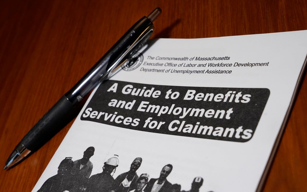 A booklet issued during the COVID-19 pandemic describing unemployment benefits is seen on a desk, in North Andover, Massachusetts. 