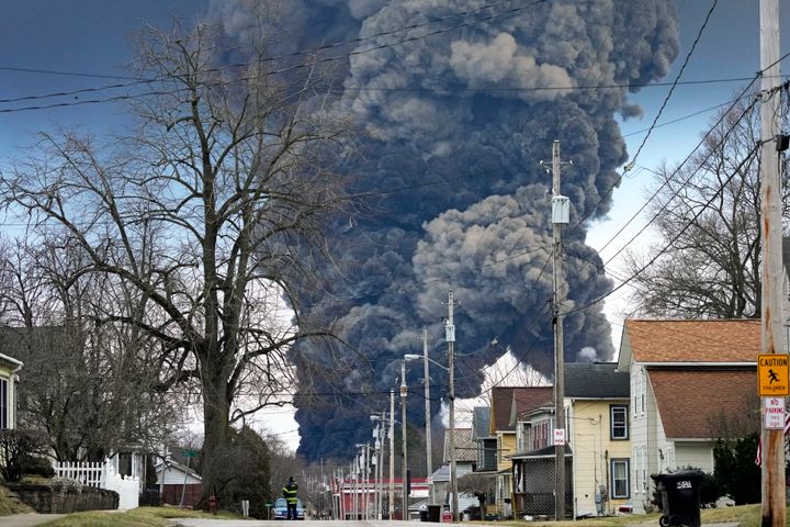Thick black smoke rises over East Palestine, Ohio, on Feb. 6 after authorities conducted a vent and burn of five tank cars of vinyl chloride.