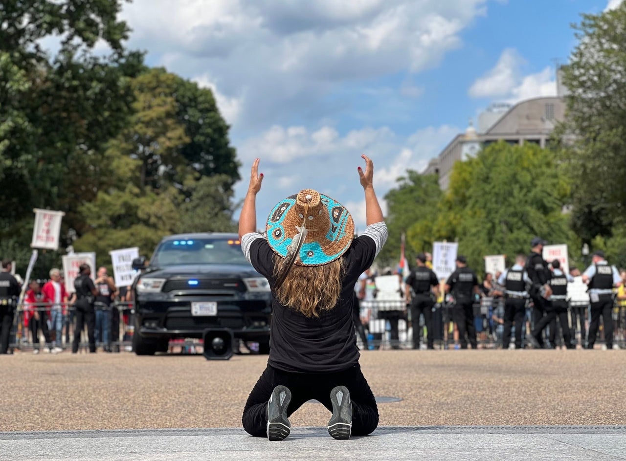 Fawn Sharp, president of the National Congress of American Indians, prays for Leonard Peltier before getting arrested at a White House rally in support of his freedom.