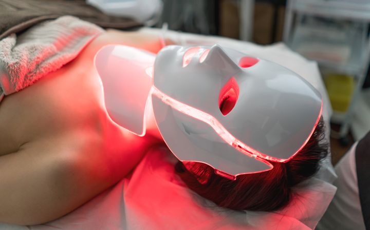At-home versions of devices like this red light mask are available for purchase, but do they work?