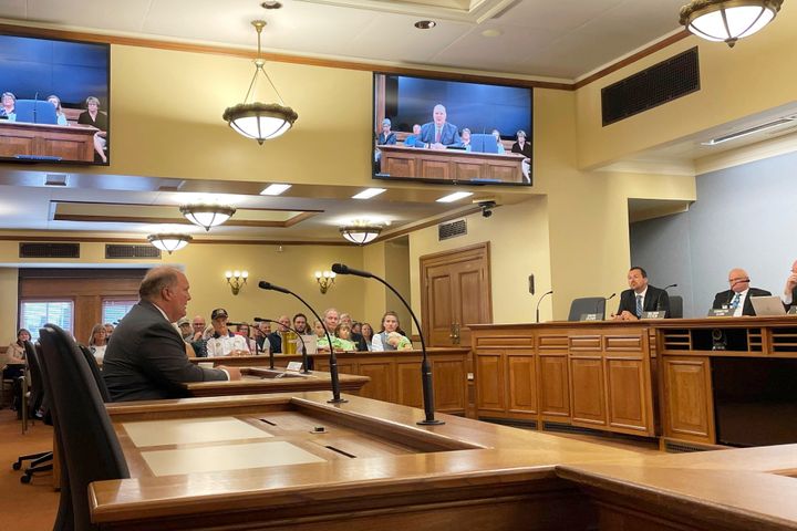 Former Wisconsin Supreme Court Justice Michael Gableman, left, testifies at a Senate elections committee hearing in Madison, Wis., Tuesday, Aug. 29, 2023, against reappointing Meagan Wolfe as administrator of the Wisconsin Elections Commission. (AP Photo/Harm Venhuizen)