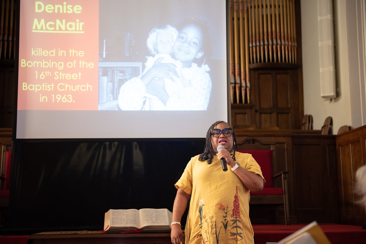 Lisa McNair talks to a group at the 16th Street Baptist Church about her sister Denise McNair, who was killed during the church bombing.