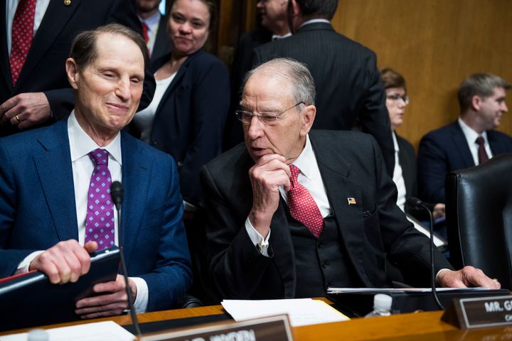 Sen. Charles Grassley (R-Iowa), right, consults Sen. Ron Wyden (D-Ore.) before a 2019 hearing on prescription drug prices. Their bill to address the problem never got a floor vote.