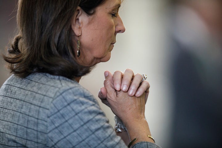 Texas State Sen. Angela Paxton, R-McKinney, wife of suspended Texas state Attorney General Ken Paxton, bows her head in prayer before as her husband's impeachment trial resumes in the Senate Chamber at the Texas Capitol on Friday, Sept. 15, 2023, in Austin, Texas. She will not be eligible to cast a vote in the her husband's impeachment trial. (Sam Owens/The San Antonio Express-News via AP, Pool)