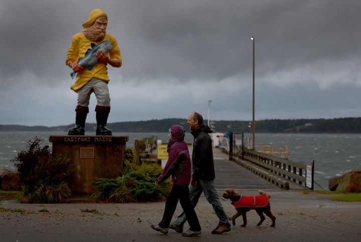 EASTPORT, MAINE - SEPTEMBER 16: People walk as wind and rain from what was formerly Hurricane Lee and is now a post-tropical cyclone affect the area on September 16, 2023 in Eastport, Maine.  The storm was downgraded, but forecasters say it will remain large and dangerous.  (Photo by Joe Raedle/Getty Images)