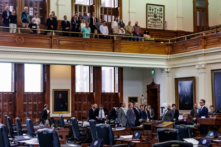 Texas Attorney General Ken Paxton stands with his defense attorneys Tony Buzbee and Mitch Little as his impeachment trial resumes in the Senate Chamber at the Texas Capitol on Friday, Sept. 15, 2023, in Austin, Texas. (Sam Owens/The San Antonio Express-News via AP, Pool)