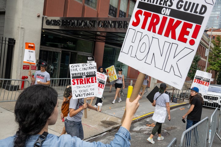 Writers Guild of America East members picketing outside of "The Drew Barrymore Show" in New York last Tuesday, after Barrymore initially announced the show would return without its striking writers.