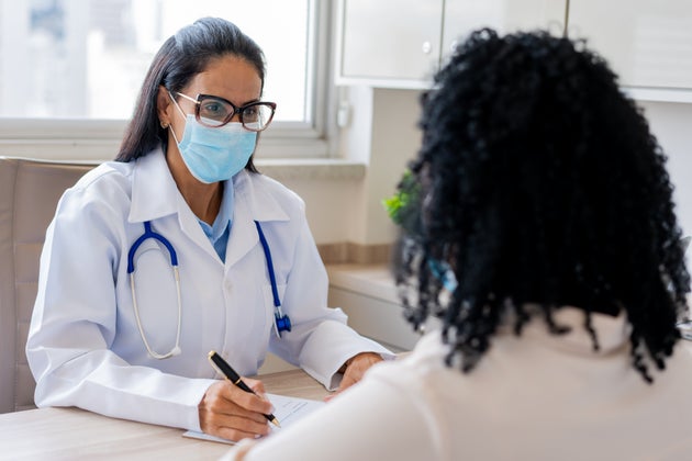 Here's how infectious disease experts are managing their COVID-19 risk.