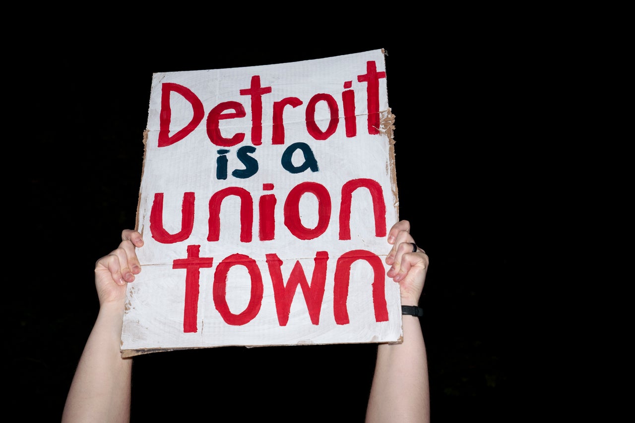 Justin Skytta, of Livonia, holds his sign in solidarity with United Auto Workers members across the street from Ford’s Michigan Assembly Plant in Wayne, Michigan, on Thursday, Sept. 14th.