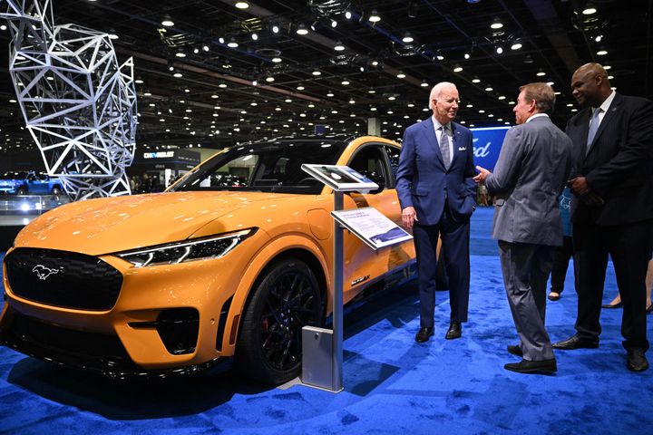 President Joe Biden speaks with Ford Executive Chairman William Clay Ford Jr. (center) and then-UAW President Ray Curry in September 2022.