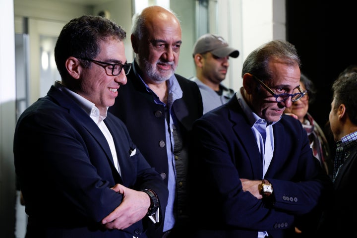 U.S officials arrange a group photo after freed Americans Siamak Namazi, Morad Tahbaz and Emad Shargi, as well as two returnees not yet named by the U.S. government, who were released in a prisoner swap deal between U.S and Iran, arrived at Davison Army Airfield, on Sept. 19, 2023 at Fort Belvoir, Va.