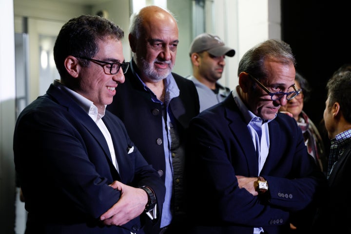 U.S officials arrange a group photo after freed Americans Siamak Namazi, Morad Tahbaz and Emad Shargi, as well as two returnees not yet named by the U.S. government, who were released in a prisoner swap deal between U.S and Iran, arrived at Davison Army Airfield, on Sept. 19, 2023 at Fort Belvoir, Va. 