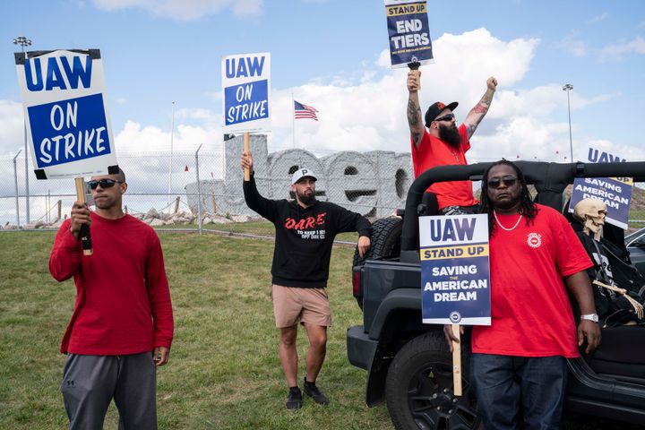 United Auto Workers (UAW) members Kaleb Delfine, Bryan Broecker, Michael Gatto and James Triplett picket outside the Jeep Plant on Sept. 18 in Toledo, Ohio.