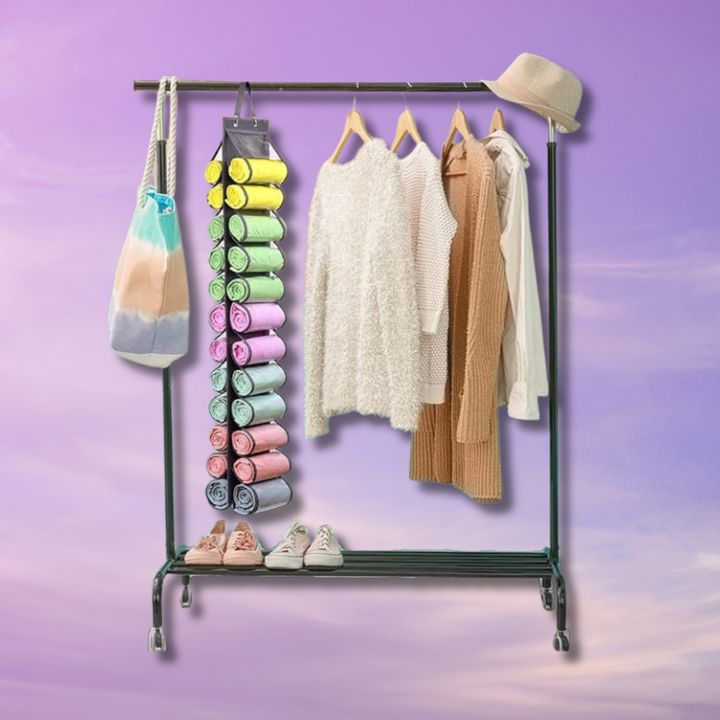 The leggings organizer hanging from a clothing rack.