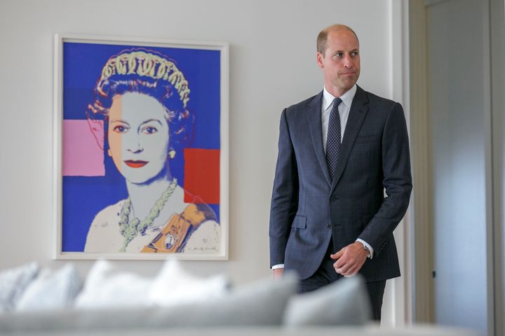 Prince William walks near an Andy Warhol print of his late grandmother, Queen Elizabeth II, to meet the president of Ecuador, Guillermo Lasso, on Sep. 19, 2023.
